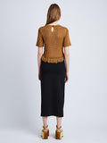 Back full length image of model wearing Ribbon Crochet Fringe Top in SADDLE