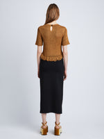 Back full length image of model wearing Ribbon Crochet Fringe Top in SADDLE