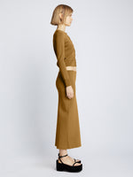 Side full length image of model wearing Silk Viscose Skirt in OCHRE