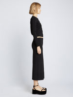 Side full length image of model wearing Silk Viscose Knit Skirt in BLACK