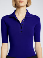 Detail image of model wearing Silk Viscose Polo Bodysuit in COBALT