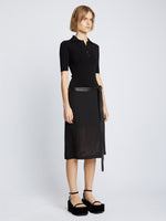 Side full length image of model wearing Silk Viscose Polo Bodysuit in BLACK