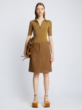 Front full length image of model wearing Silk Viscose Polo Bodysuit in OCHRE