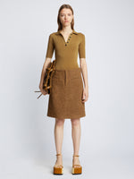 Front full length image of model wearing Silk Viscose Polo Bodysuit in OCHRE