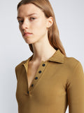 Detail image of model wearing Silk Viscose Polo Bodysuit in OCHRE