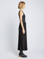 Side full length image of model wearing Metallic Knit Dress in BLACK