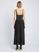 Back full length image of model wearing Metallic Knit Dress in BLACK
