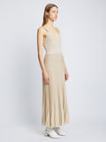 Side full length image of model wearing Metallic Knit Dress in CHAMPAGNE