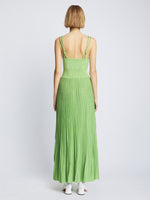 Back full length image of model wearing Metallic Knit Dress in GREEN