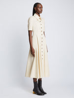 Side full length image of model wearing Silk Cotton Shirt Dress in ECRU