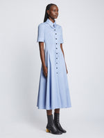 Side full length image of model wearing Silk Cotton Short Sleeve Button Dress in PERIWINKLE