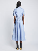 Back full length image of model wearing Silk Cotton Short Sleeve Button Dress in PERIWINKLE