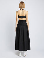 Back full length image of model wearing Viscose Linen Ruched Dress in BLACK