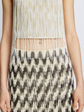 Detail image of model wearing Graphic Beaded Fringe Embroidered Top in WHITE MULTI