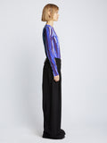Side full length image of model wearing Painted Stripe T-Shirt in COBALT MULTI