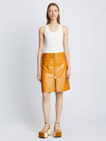 Front full length image of model wearing Glossy Leather Skirt in CARAMEL