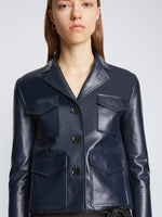 Detail image of model wearing Glossy Leather Jacket in NAVY