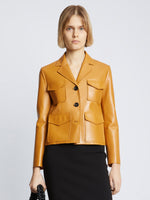 Front cropped image of model wearing Glossy Leather Jacket in CARAMEL