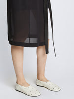 Image of model wearing GLOVE STUDDED SLIPPERS in Natural