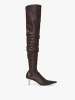 Side image of SPIKE STRETCH OVER-THE-KNEE BOOTS in Black with leather wrinkled