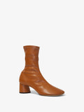 Front 3/4 image of GLOVE STRETCH ANKLE BOOTS in Medium Orange