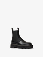 Front 3/4 view of Lug Sole Platform Chelsea Boots in black