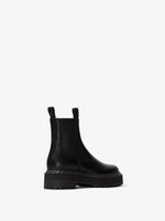Back 3/4  view of Lug Sole Platform Chelsea Boots in black