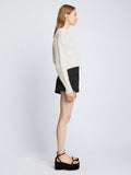 Side full length image of model wearing Textured Cotton Sweater in IVORY