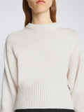 Detail image of model wearing Textured Cotton Sweater in IVORY