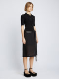 Side full length image of model wearing Crepe Chiffon Wrap Skirt in BLACK