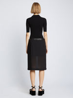 Back full length image of model wearing Crepe Chiffon Wrap Skirt in BLACK