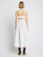 Back full length image of model wearing Viscose Linen Ruched Dress in OFF WHITE
