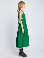 Side full length image of model wearing Viscose Linen Ruched Dress in BRIGHT GREEN