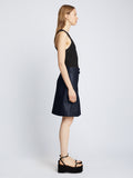 Side full length image of model wearing Glossy Leather Skirt in NAVY