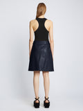 Back full length image of model wearing Glossy Leather Skirt in NAVY