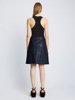 Back full length image of model wearing Glossy Leather Skirt in NAVY