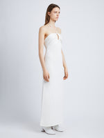 Side full length image of model wearing Textured Cotton Knit Halter Dress in IVORY