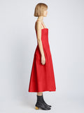 Side full length image of model wearing Poplin Pintuck Dress in RED