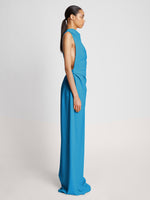 Side image of model wearing Matte Viscose Crepe Backless Dress in turquoise