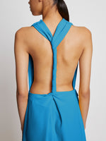 Detail image of model wearing Matte Viscose Crepe Backless Dress in turquoise