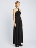 Side image of model wearing Matte Jersey Dress in black