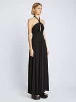 Side image of model wearing Matte Jersey Dress in black