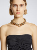 Image of chain necklace in gold on model