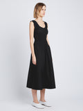 Side full length image of model wearing Poplin Gathered Dress in BLACK