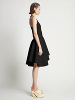 Side image of model wearing Sculpted Knit Dress in black