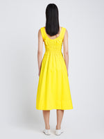Back image of model wearing Poplin Gathered Midi Dress in sun