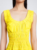 Detail image of model wearing Poplin Gathered Midi Dress in sun