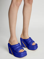 Image of model wearing Arc Platform Slides in Bright Blue