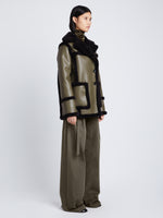Side full length image of model wearing Faux Sherpa Jacket in WOOD/BLACK