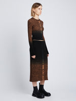 Side full length image of model wearing Gradient Marl Cardigan in BROWN MELANGE / BLACK